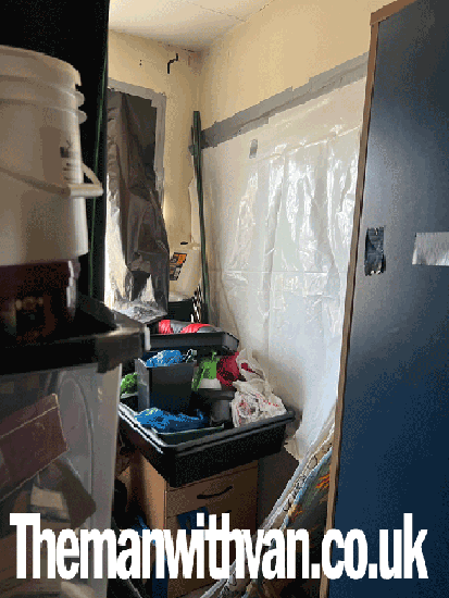 House clearance furniture being loaded onto a van in London