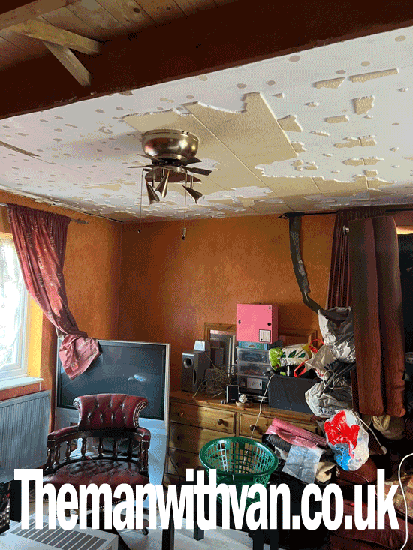 Man with a van house clearance in London loading a van